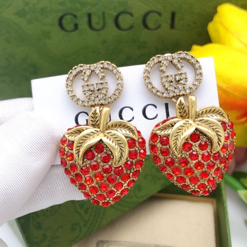 G*u*i earrings
